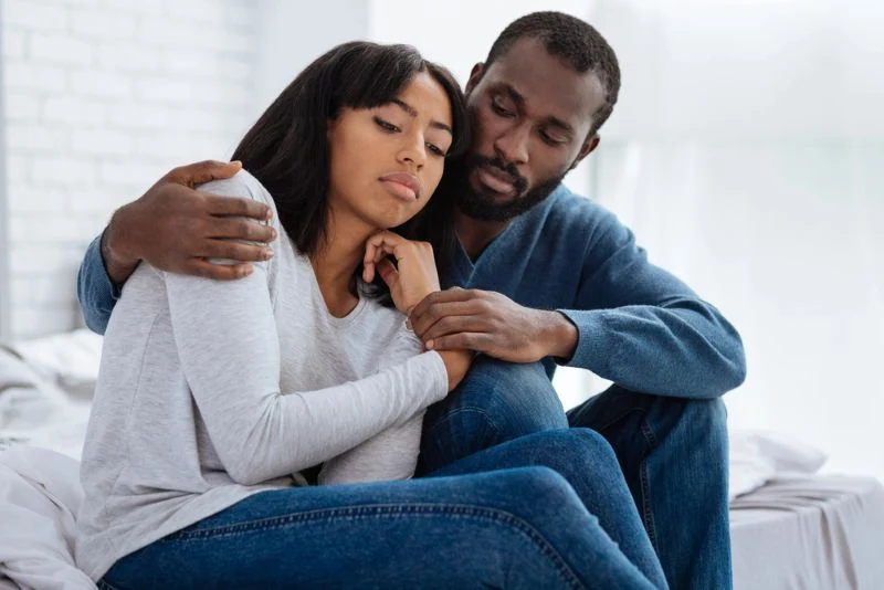 couple comforting eachother